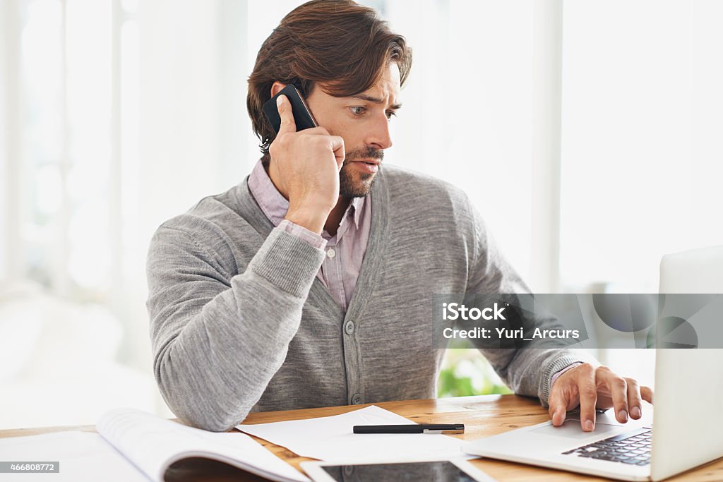 Connected to the world A handsome businessman speaking on his mobile at his deskhttp://195.154.178.81/DATA/istock_collage/0/shoots/783044.jpg 2015 Stock Photo