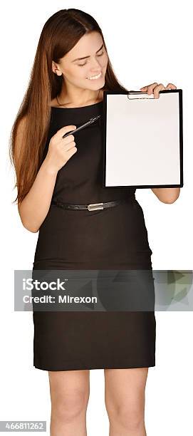 Business Woman Holding A Pen And Clipboard Stock Photo - Download Image Now - 2015, Adult, Adults Only