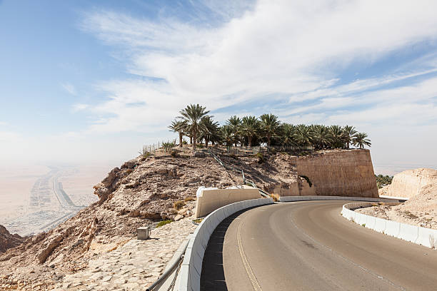 Jebel Hafeet mountain Road in Al Ain Jebel Hafeet mountain road in the outskirts of Al Ain, Emirate of Abu Dhabi, UAE jebel hafeet stock pictures, royalty-free photos & images