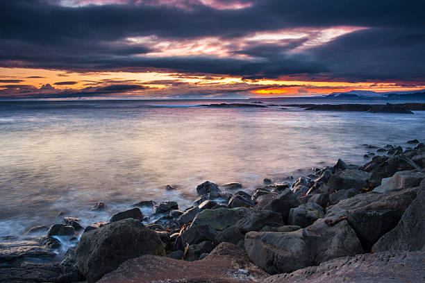 istock Dramatic long exposure seascape at sunset with moody sky, Iceland 466811938