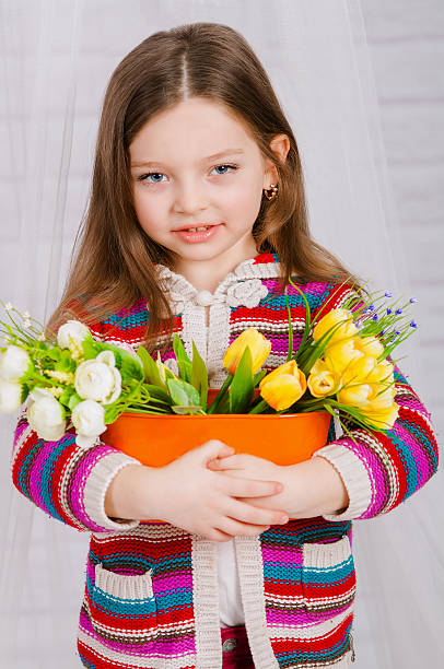istock Little girl with spring flowers 466812174
