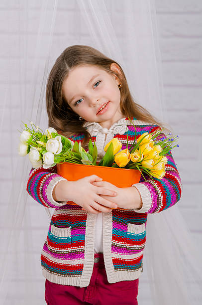 istock Little girl with spring flowers 466814078