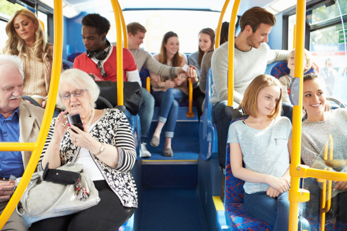 Interior Of Bus With Passengers During The Day