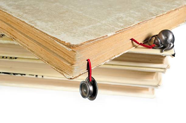 istock Stack of used books with a hand-made bookmark 466816326