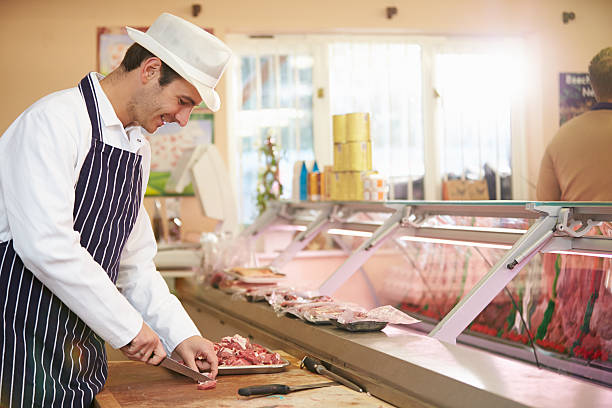istock Butcher preparing meat in old fashioned meat market 466816565