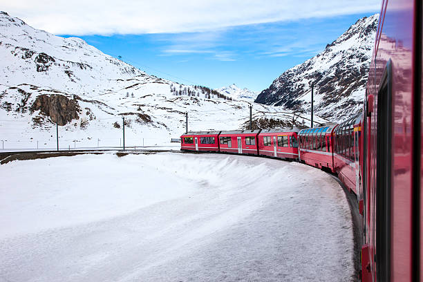 istock Red railway traversing snowy mountains 466819710