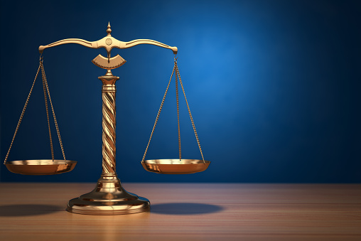 Concept of justice. Law scales on blue background. 3d