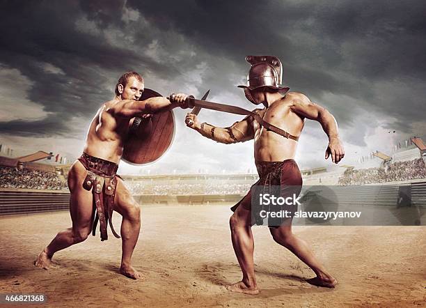 Gladiators Fighting On The Arena Of The Colosseum Stock Photo - Download Image Now - Gladiator, Fighting, Rome - Italy