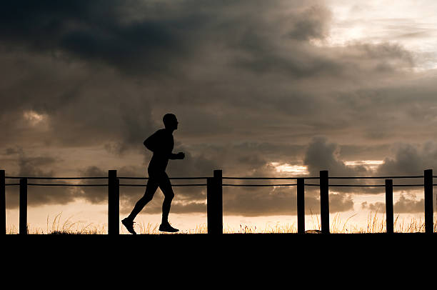a runner is trainning at sunset