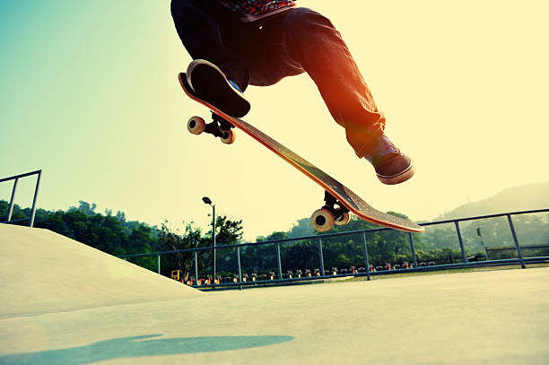 istock skateboarding  jumping at  sunrise 466824696