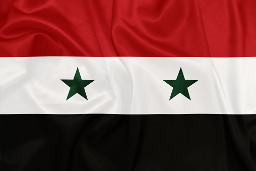 Syria - Waving national flag on silk texture