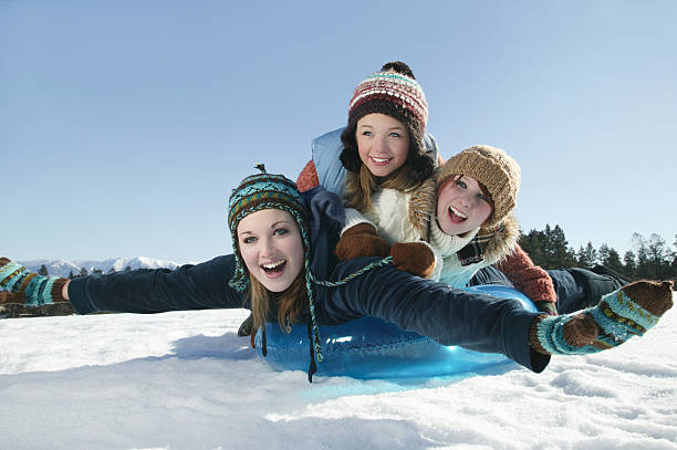 istock Friends Sledding At Winter Time 466825605
