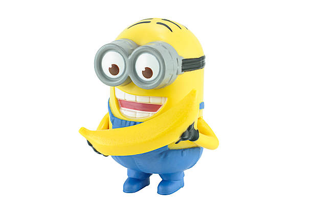 Bangkok,Thailand - February 17, 2014: Minion Dave with yellow banana figure toy character from Despicable Me 2 movie. There are plastic toy sold as part of the McDonald's Happy meals.