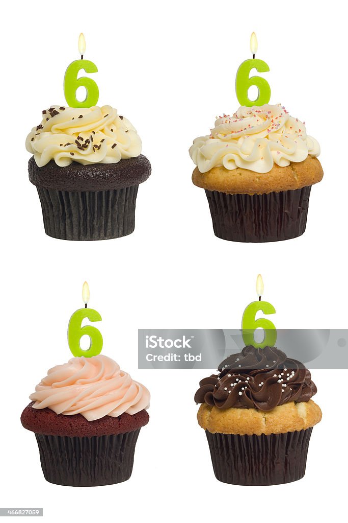 Numbered Cupcake Four different cupcakes: vanilla-chocolate, vanilla-vanilla, red-velvet and chocolate-vanilla. Each has a lit number 6 candle (see the "more cupcakes" link below to see  the rest of this series, featuring all single digit numbers). Shot against a pure white background. Cut Out Stock Photo