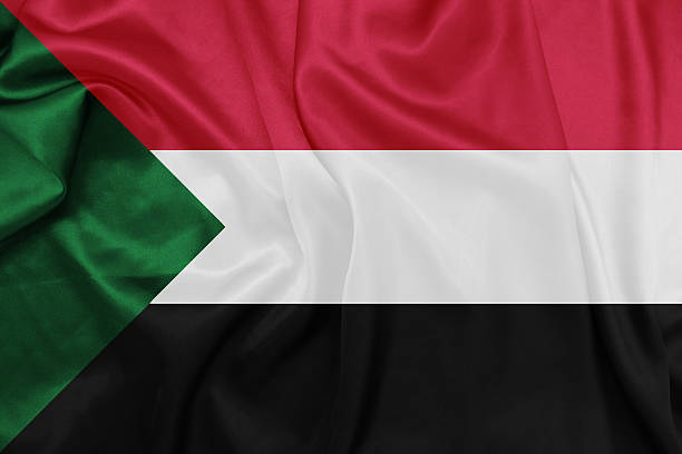Sudan - Waving national flag on silk texture