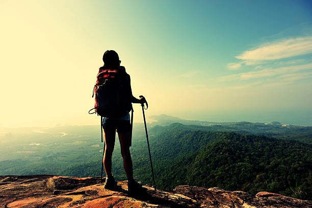 istock hiking woman enjoy the view on mountain peak 466828596