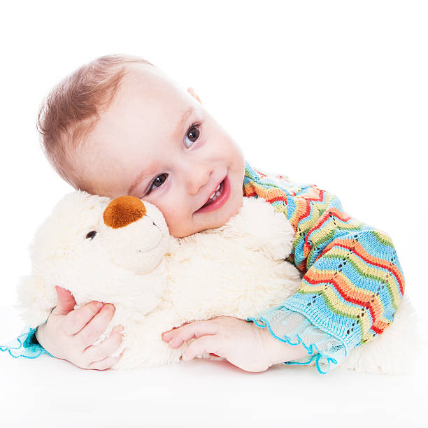 istock Little girl with teddy bear 466830226
