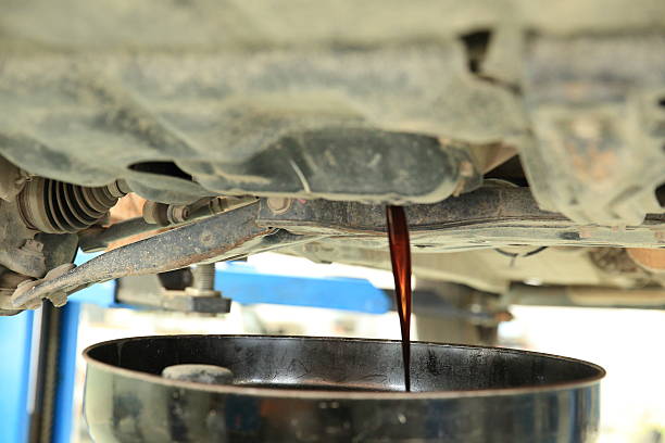 istock draw off  the used engine oil of car 466831724