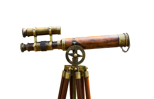 Antique brass telescope on white background
