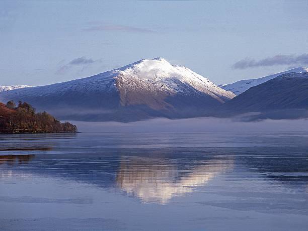 Loch Fyne Argyll in Winter Loch Fyne Argyll provides an attractive foreground to the surrounding mountains of The Arrochar Alps in this Winter view. loch fyne stock pictures, royalty-free photos & images
