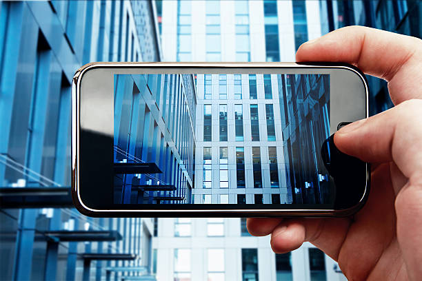 istock Smart phone mobile photo with office building 466834822