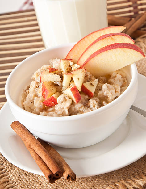 istock Oatmeal with apples and cinnamon in a white bowl 466837665