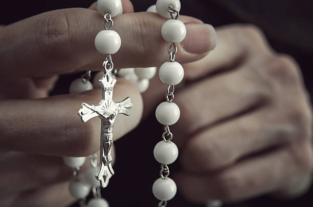 istock Woman  with rosary 466839453