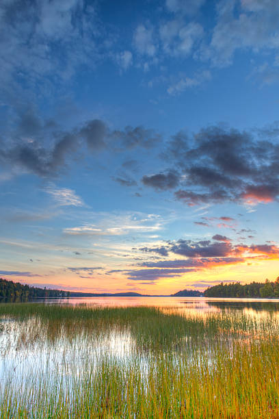 A beautiful sunset in a the sky over Little Tupper Lake