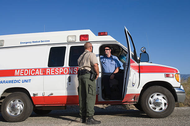 istock Police man talking with paramedic 466842316