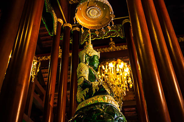 Chiang Rai, Thailand - May 2, 2013: Statue of Emerald Buddha in the temple named Wat Phra Kaeo.