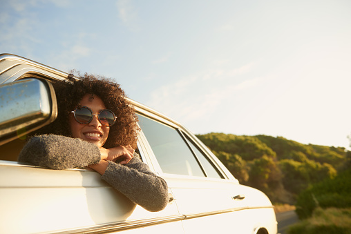 Cropped shot of an attractive young woman leaning out of a car window on a roadtriphttp://195.154.178.81/DATA/istock_collage/a5/shoots/785271.jpg