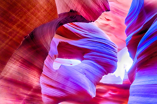 Lower Antelope Canyon in Page Arizona.  The canyon glows in colors of purple, reds and oranges. Shot a Canon 5D mark 3