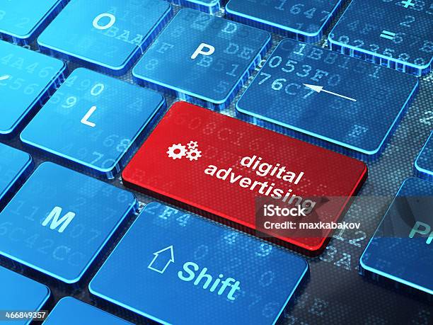 Gears And Digital Advertising On Computer Keyboard Background Stock Photo - Download Image Now