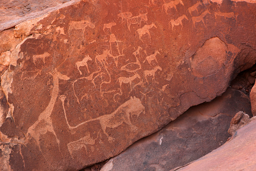 Rock engravings of various animals, including Lion Man, at UNESCO site Twyfelfontein in Namibia.