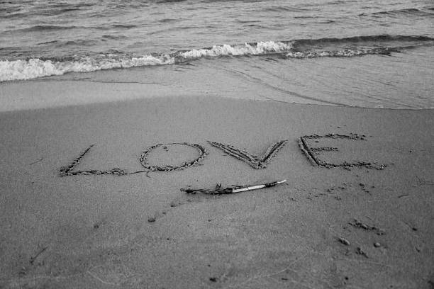 istock Writing Love in the Sand at Beach B&W 466851785