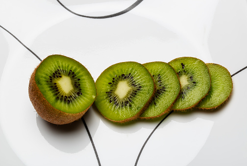 Sliced Kiwifruit on a white plate