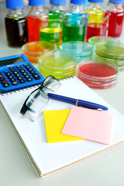istock calculator and colorful fluid in glassware 466853854