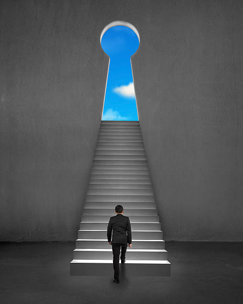 istock Businessman climbing on stair to key shape door 466855301