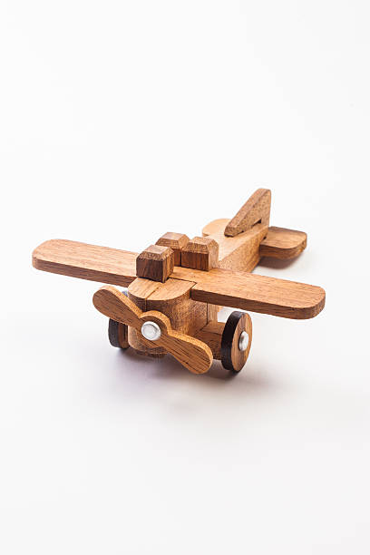 istock Wooden toy airplane isolated on white 466863336