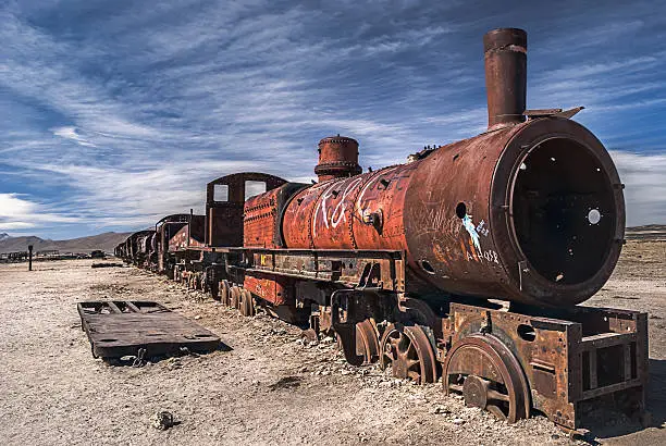 Photo of Old, rusted, train at the Cemetery of trains, Uyuni, Bolivia.