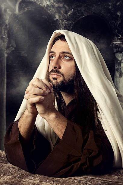 istock Jesus praying and looking up to heaven while he cries 466864965