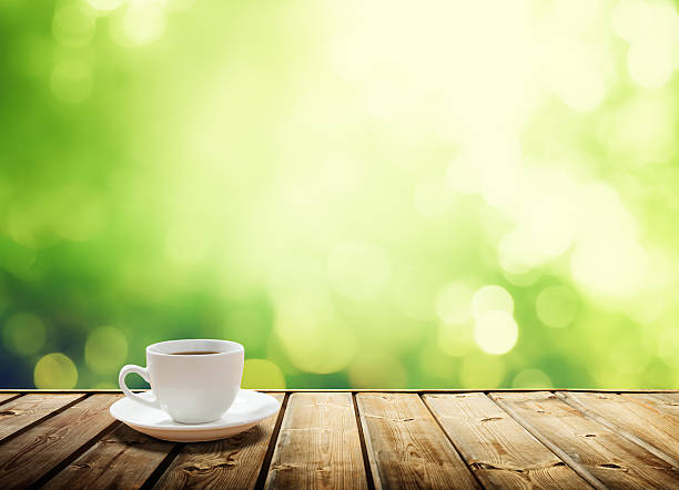 istock White coffee cup and saucer on a wooden table 466865302