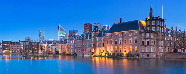 The Binnenhof in The Hague, The Netherlands at night The Dutch Parliament buildings at the Binnenhof from across the Hofvijver pond in The Hague, The Netherlands at night. binnenhof photos stock pictures, royalty-free photos & images