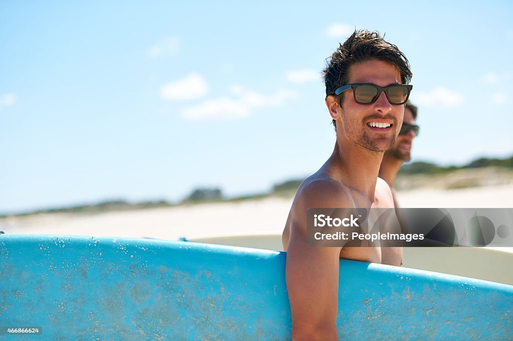 Heading to the water Two friends at the beach getting ready to head into the water for a surfhttp://195.154.178.81/DATA/istock_collage/0/shoots/785334.jpg Macho Stock Photo