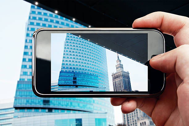 istock Smart phone mobile photo with office building 466868962