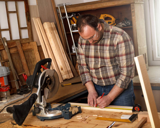istock Carpenter marking a measurement on a wooden plank 466872544
