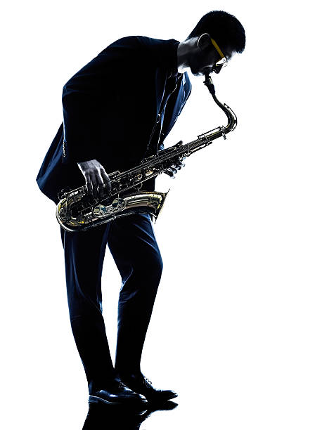 istock man saxophonist playing saxophone player  silhouette 466873778