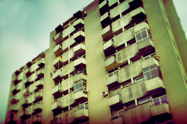 Urban An old apartment building, taken with wide angle tilt shift lens. ljubljana slums stock pictures, royalty-free photos & images