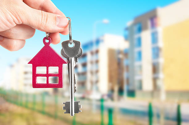 istock Handing keys in the house background 466878252