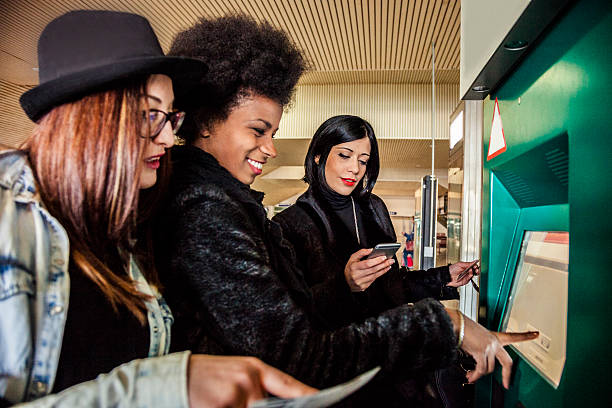 istock Women friends making tickets for the train 466878268